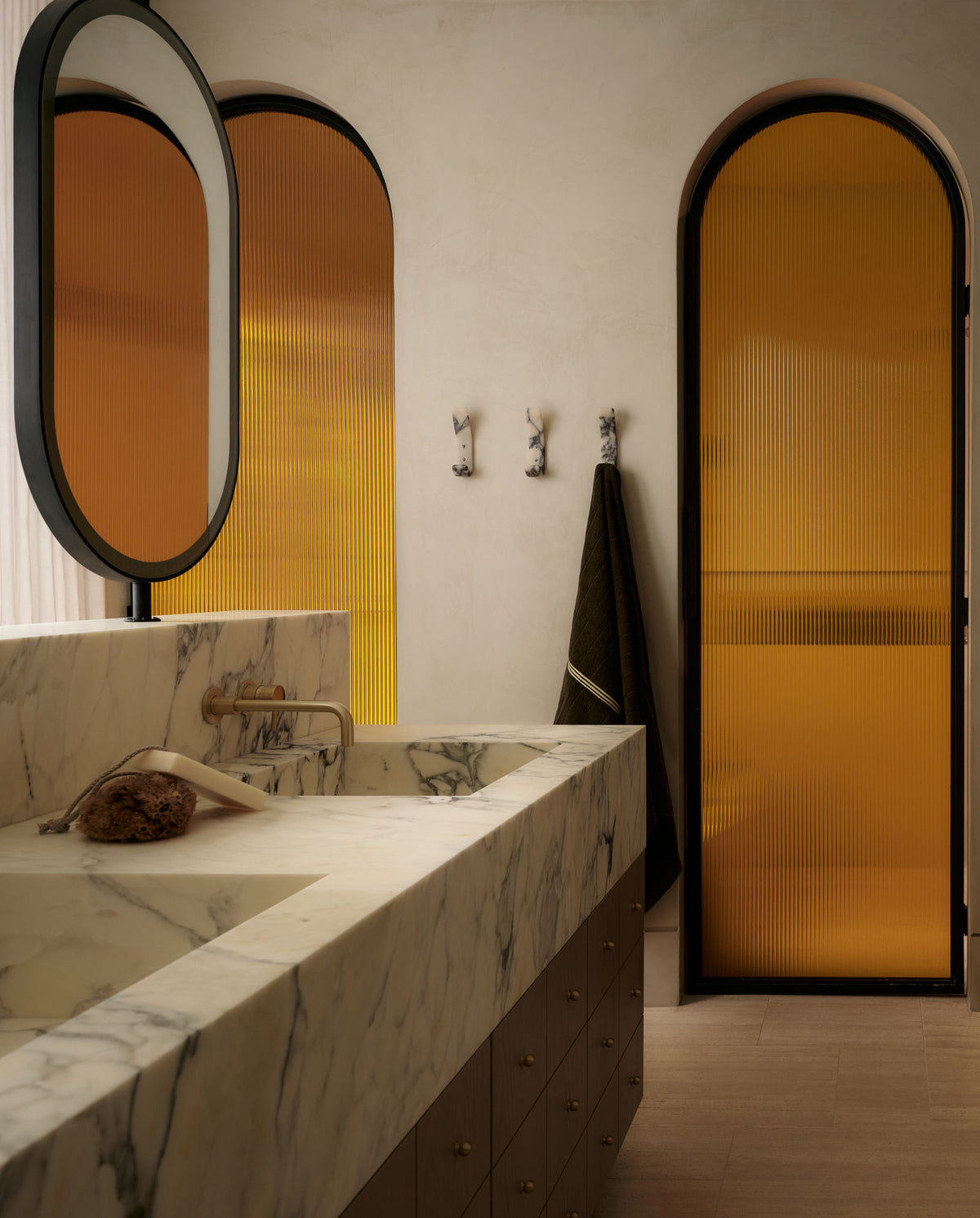 Cortleigh bathroom with arched fluted glass doors, Montana Labelle Design